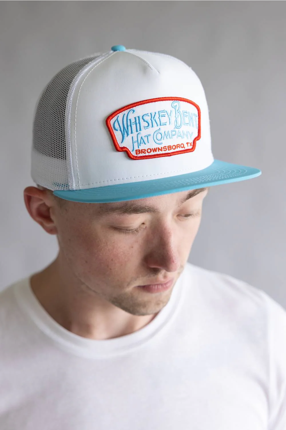 Whiskey Bent Candy Land Trucker Hat for Men in White/Teal | CANLAN-WHITEBLUERED - Image 2